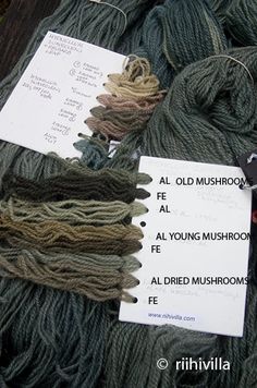 several skeins of yarn with tags attached to them