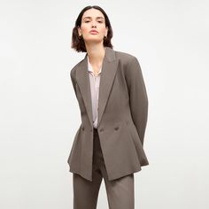 This truly special piece features strong lapels, a cinched waist, and front pleats that set it apart from other blazers. Roomy pockets provide a place to stash your essentials. For more casual days, dress it down with jeans. ﻿ Made in China with fabric from Italy. Elegant Notch Lapel Outerwear For Office, Elegant Structured Blazer With Lapel Collar, Tailored Pantsuit With Lapel Collar For Semi-formal Occasions, Elegant Fall Blazer With Concealed Placket, Chic Tailored Structured Blazer, Chic Notch Lapel Blazer Dress With Pressed Crease, Timeless Structured Semi-formal Outerwear, Elegant Structured Outerwear For Office, Chic Structured Blazer For Semi-formal Occasions