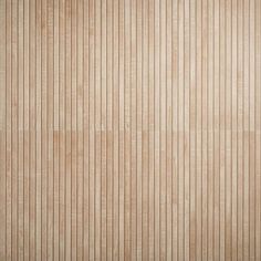 a beige wall with vertical stripes on it