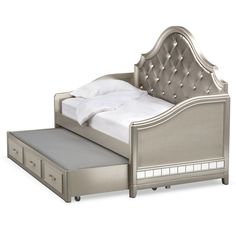 a silver bed with drawers underneath it and a white sheet on the bottom half, in front of a white background