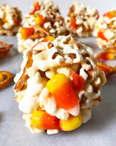 candy corn and pretzel treats are arranged on a table