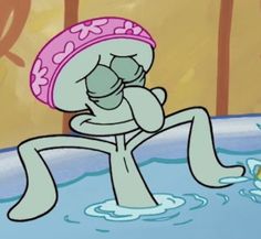 a cartoon character sitting in the water with his hands on his face and eyes closed