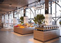 the inside of a restaurant with lots of food on display in front of large windows