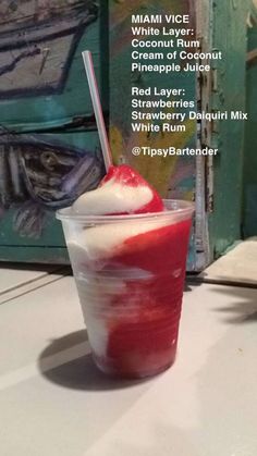 an image of a red drink in a plastic cup