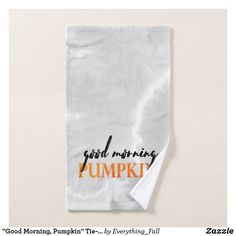 a white towel with the words good morning pumpkin printed on it and an orange stripe