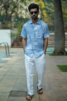 Blue half sleeves button down shirt crafted in 100% linen with all over Bali vibes print. - Aza Fashions Blue Linen Short Sleeve Shirt For Spring, Printed Short Sleeve Linen Shirt, Printed Relaxed Fit Linen Tops, Spring Blue Linen Short Sleeve Shirt, Printed Linen Short Sleeve Shirt, Printed Relaxed Fit Linen Shirt, Linen Short Sleeve Button-up Shirt For Vacation, Linen Half Sleeve Shirt Men, Men Shirts Casual