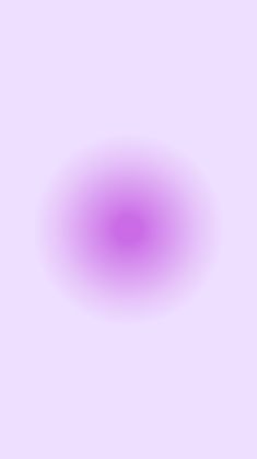 a blurry image of a purple circle on a white background