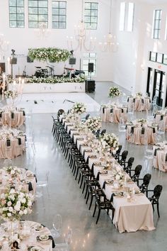 a large banquet hall with tables and chairs