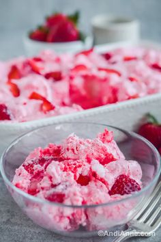 two bowls filled with ice cream and strawberries next to each other on a table