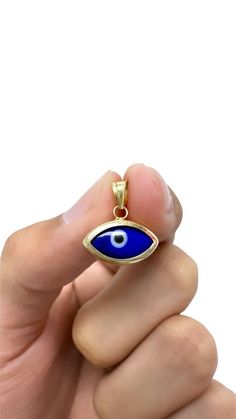 Embrace the mystical allure and protective energy of our 14K Evil Eye Pendants. Meticulously crafted with intricate detail, these pendants showcase the powerful and ancient symbol of the Evil Eye. Crafted from premium 14K gold, these pendants radiate with a captivating glow. The 14K gold adds a touch of luxury, enhancing the intricate design of the Evil Eye and making it a cherished piece that can be worn daily or on special occasions. The Evil Eye is a symbol deeply rooted in various cultures a Protection Charms, Protective Energy, Fatima Hand, Necklace Evil Eye, Hand Pendant, Pendants Necklace, Luck Charm, Hand Of Fatima, Ancient Symbols