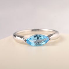 All HANDMADE ITEMS SHIP IN APPROX 8 DAYS Main Stone: Genuine Swiss blue topaz Main Stone Size: Marquise cut 5 mm x 10 mm Main Stone Weight: 1.29 carat Side Stone: None Height From The Ring Setting Bottom(to gemstone top): about 5.10 mm Width of Ring band Measure: gradually varied,about 2.12 to 2.63 mm Material: .925 Sterling Silver/14K White Gold/14K Yellow Gold/14k Rose Gold Engraved: Available For FreeNo more than 13 letters) Customized:Of course! Tell me what you want Includes With Order: All Marquise Cut Blue Topaz Ring As Gift, Blue Marquise Topaz Ring As Gift, White Topaz Marquise Cut Ring Gift, Silver Marquise Cut Blue Topaz Ring, Blue Topaz Ring, Marquise Cut, London Blue Topaz Ring, Gold Engraving, Local Jewelry, Swiss Blue Topaz