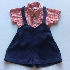 "Vintage Toddler Shortalls w/ Shirt Set is cute and classic! Adorable 80s red and white checked shirt is from \"Park Bench Kids\" and has country western styling w/ patch pocket. This cute shirt has been paired up w/ the navy blue 70s possibly 60s shortalls. Shortalls have adjustable two button straps and back of waistband has elastic.   The shirt size label indicates a US infants 24 months. The shortalls have no label but would judge them at about the same size. Please check measurements below Summer Cotton Button-up Overalls, Vintage Cotton Shortalls For Spring, Casual Red Cotton Shortalls, Retro Cotton Shortalls For Spring, Vintage Bib Front Overalls For Summer, Vintage Cotton Summer Overalls, Vintage Cotton Top For Picnic, Retro Bib Front Shortalls For Spring, Vintage Bib Front Shortalls For Spring