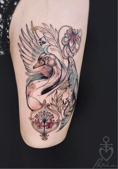 a woman's leg with an artistic tattoo design on the side of her body