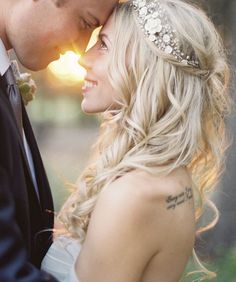 a bride and groom standing close to each other