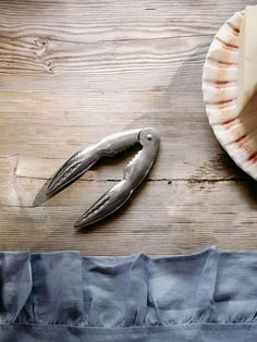 a knife and some food on a wooden table