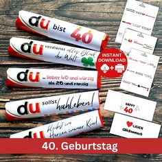 four rolls of candy with the words 40 gebursttag on them and two envelopes