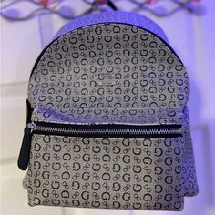 Mini Grey Backpack,, Durable,, Never Used,, Thick Leather Type Material,, Grey And Black Outside With Tan Interior,, All Zippers Work All Pockets Functional Trendy Gray Backpack With Adjustable Strap, Trendy Gray Backpack, Trendy Gray Standard Backpack, Grey Backpacks, Guess Bags, Backpack Purse, Black And Grey, Bag Lady, Backpacks