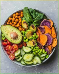 a bowl filled with lots of different types of vegetables and fruits on top of each other