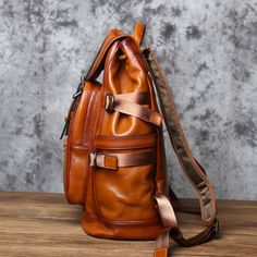 Discover the ultimate men's travel companion in our genuine leather backpack. A stylish rucksack that's a perfect gift for him. Free shipping on all our leather bags. It takes approx seven business days to complete each leather bag. Features: 1. High-quality leather material for durability and style. 2. Spacious main compartment for all your essentials. 3. Additional front and side pockets for easy access to smaller items. 4. Stylish vintage design for a unique and timeless look. 5. Interior: Ce Leather Backpack For Trip, Luxury Brown Leather Backpack For Trips, Luxury Brown Backpack For Outdoor, Luxury Brown Leather Backpack For Travel, Classic Brown Leather Backpack For Trip, Rucksack Style, Men Backpack, Rucksack Bag, Mens Travel