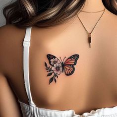 a woman with a butterfly tattoo on her upper back shoulder and chest, in white tank top