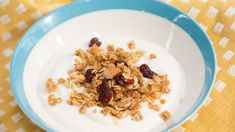 a bowl filled with granola on top of a table