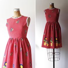 Measurements and details: Bust 32-34 * Waist 26-28 * Length 35 * Hips up to 50 * shoulder to waist 14 Too early for floral prints?! Never  crispy cotton day dress with  Polkadots and adorable floral print * fitted waist * Made of cotton * back zipper for closure * 🛑Shipping Information 🛑 Please note you will receive tracking the Monday after your purchase has been completed and your package will be dropped off that Friday at the post office. Due to my location and schedule I only drop off once a week. Thank you for your understanding and kindness. Please feel free to message me any questions.  Thank you! Retro Spring Dresses With Strawberry Print, Retro Dresses With Strawberry Print For Spring, Spring Cotton Dresses With Fruit Print, Spring Cotton Dress With Fruit Print, Retro Fruit Print Dresses For Spring, Sleeveless Cotton Dress With Fruit Print, Retro Cotton Floral Print Dress, Retro Cotton Dress With Floral Print, Sleeveless Cotton Dress With Daisy Print