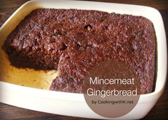 a close up of a cake in a pan with the words minemeat gingerbread on it