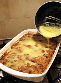 a pan filled with food sitting on top of a stove next to a burner