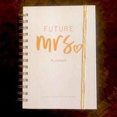 a book with the title'future mrs so planner'written in gold on it