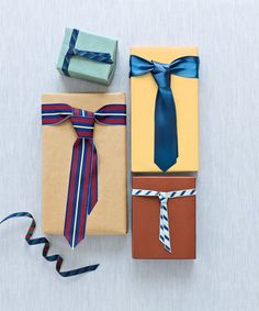 three wrapped gift boxes with ribbons on them