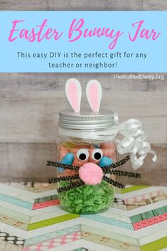 a mason jar filled with candy and bunny ears