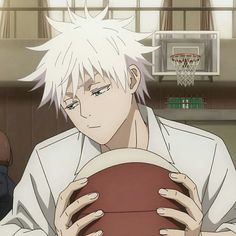 an anime character holding a basketball in his hands