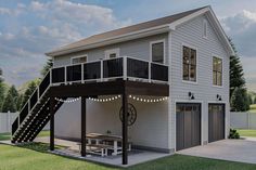 a two story house with a deck and stairs leading up to the upper level balcony