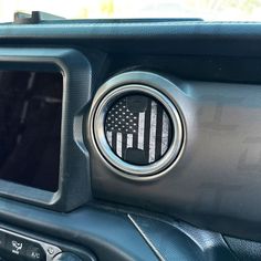 an american flag on the center console of a car