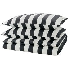 three black and white pillows stacked on top of each other