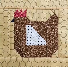 a close up of a piece of fabric with a chicken on it