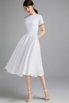 "The linen dress is the epitome of feminine chic and is sure to turn heads. DETAILS * 50% Linen + 50% cotton, soft and draply! * Cotton liner on upper part * Two side seam pockets * Short sleeve * Boat-Neck * Concealed Back zip closure. * Fit and flare dress * Below knee length * Perfect for daily casual, part or other occasion, wedding guest dress. * Wash by hand or machine with cold water * More color https://etsy.me/2YhLY2t SIZE GUIDE Size vary between Brand and Country Please get your body m Elegant A-line Linen Dress For Garden Party, White Tea Length Summer Dress, Summer A-line Tea Length Bridesmaid Dress, White A-line Tea Length Dress With Fitted Bodice, Summer Wedding Tea Length Dress With Fitted Bodice, White Tea-length Summer Dress, White Linen Midi Dress For Garden Party, White Summer Tea-length Dress, Classic White Linen Midi Dress