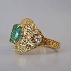 Introducing the "Emerald Scarab Ring" – a captivating blend of ancient Egyptian mystique and timeless elegance. Centered with a lush emerald framed by intricate Islamic patterns inspired by Egypt's architectural wonders, this ring evokes the opulence of ancient Egypt. Flanked by scarabs symbolizing rebirth, each holds a radiant diamond, echoing the sun's eternal sparkle on the Nile's waters. All orders come in our Tippy Taste ring box. This ring is handmade and designed in NYC. 14K or 18K solid Scarab Ring, Islamic Patterns, Radiant Diamond, Ancient Egyptian, Ring Box, Ancient Egypt, Timeless Elegance, Egypt, Lush