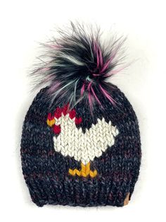 "This is a super cute Chicken Beanie, hand knit out of Lion Brand Wool Ease Super Bulky yarn in Brownstone and Wheat with a 6\" faux fur pom pom that is detachable. This is an adult women's size and measures approximately 9\" in length, not including the pom. The hat can be washed, I recommend hand wash. lay flat to dry. The pom is not washable and is attached with a snap that makes it super secure but also very easy to remove. The yarn is 20% wool 80% acrylic" Blackstone Chicken, Chicken Hats, Fur Pom Pom Hat, Cute Chicken, Lion Brand Wool Ease, Cute Chickens, Super Bulky Yarn, Super Bulky, Faux Fur Pom Pom