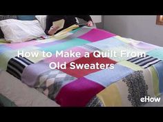 a woman sitting on top of a bed next to a blanket and pillows with the words how to make a quilt from old sweaters