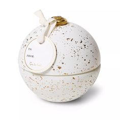 a white and gold ball with a tag on the top that says do not perfume