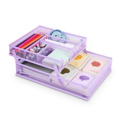 a purple desk organizer with pens, pencils and markers in it on a white background