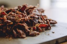 a pile of food sitting on top of a cutting board