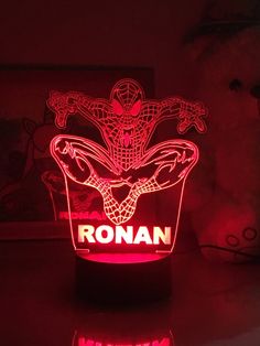 a spider man light up with the word roman on it