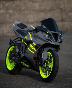 a black and yellow motorcycle parked on the street