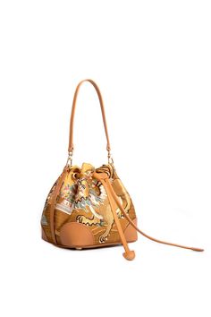 Material: Mulberry silk Cowhide Copper hardware Color: Gold, Brown The lion on the pattern of the bucket bag has the beauty of wildness. It deduces the classic fashion through the pattern and color, and expresses those women are full of courage and have extraordinary determination and courage. Gold Bucket Bag For Travel, Luxury Travel Bucket Bag, Luxury Gold Bucket Bag With Leather Handles, Gold Bucket Bag With Leather Handles For Travel, Golden Lions, Copper Hardware, Brown Bags, Classic Fashion, The Lion