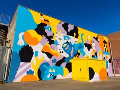 a large colorful mural on the side of a building