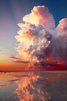 a large cloud is in the sky above water and clouds are reflected on the surface