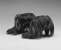 Elsa Sciaparelli’s monkey fur boots, from her Summer 1938 collection, predated similar couture footwear by Helmut Lang and Alexander Wang by almost 75 years. #vintage #fashion #shoes #boots Hunger Games Costume, Rene Magritte, V Magazine, Philadelphia Museum Of Art, Modern Shoes, Helmut Lang