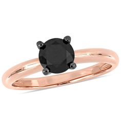 a black diamond engagement ring set in rose gold